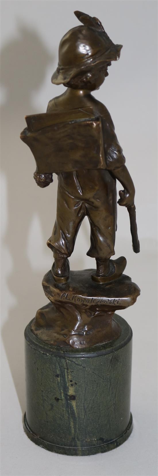 Paul Ludwig Kowalczewski (German, 1865-1910). A bronze figure of a boy wearing a backpack, overall H.11in.